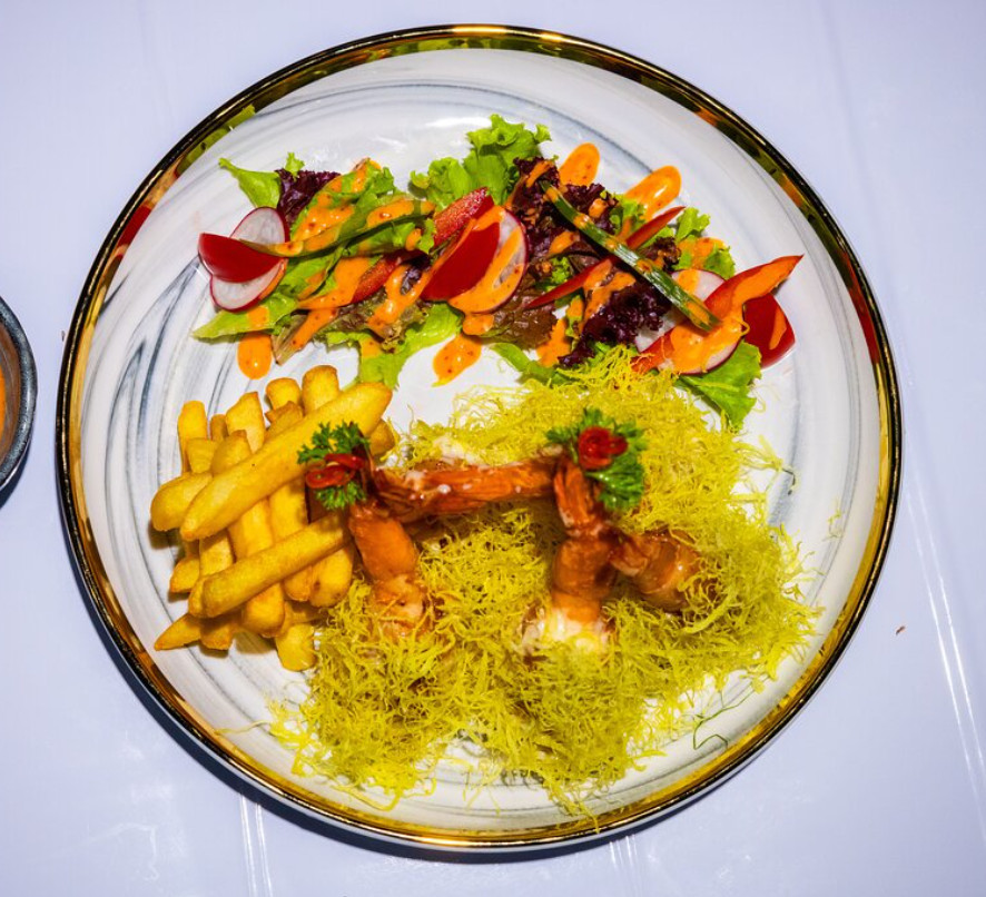 Fried Golden Royal Shrimp served with salad